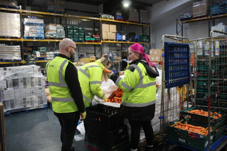 Volunteers packing food at the FareShare warehouse