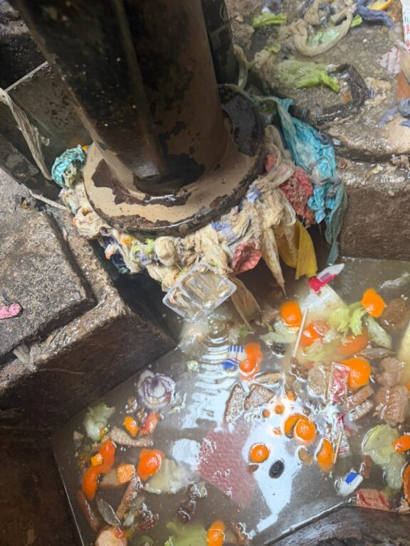 Picture of a pump chamber full of rags and orange peel