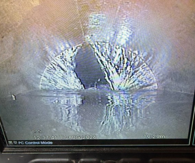 Pre-works CCTV evidence showing a significant defect and active water within the sewer prior to rehabilitation.