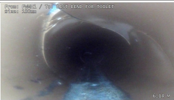 CCTV drain survey showing a hole and cracks in a drainage pipe at a residential property in King's Lynn.