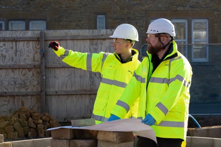 Two engineers discussing how to prevent flooding