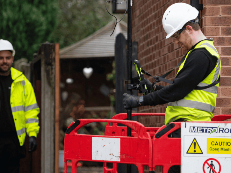 Two engineers working on a house drainage plan